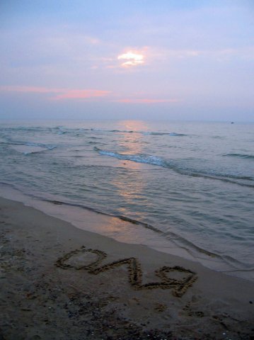 Имя Оля на морском песке