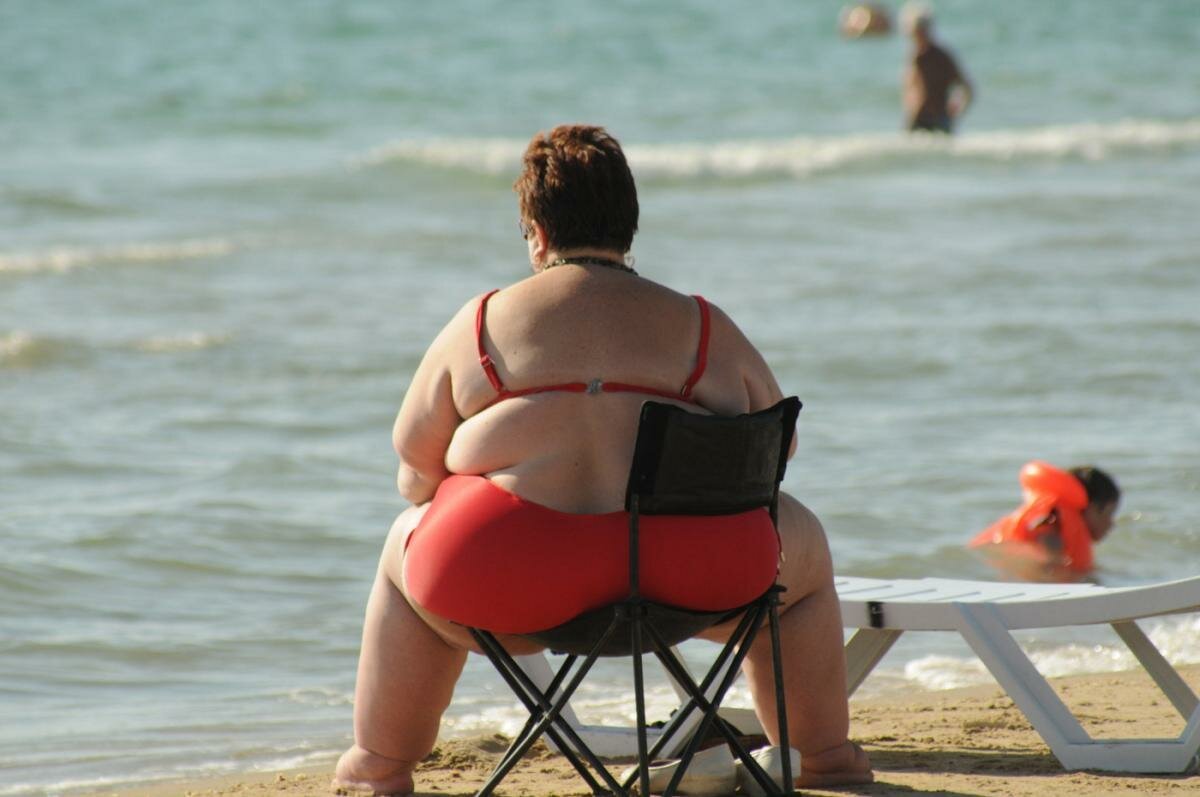 Стоковые фотографии по запросу Толстый пляж женщины