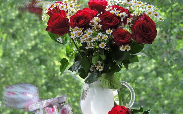 Розы ромашки хризантемы лилии