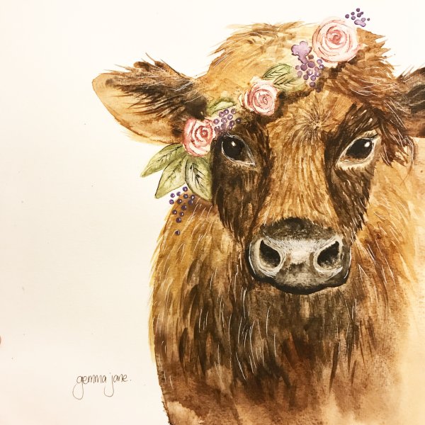 Корова в венке