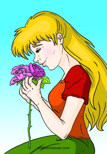 Девушка нюхает цветы