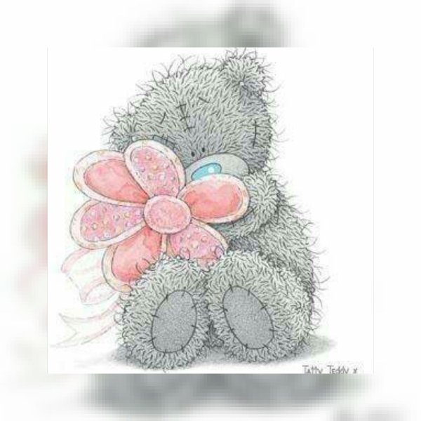 Мишка Тедди с цветком