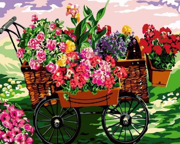 Тележка с цветами в саду
