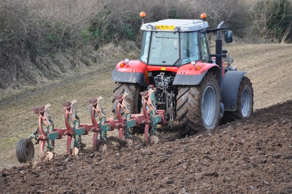 Распашка земли трактором