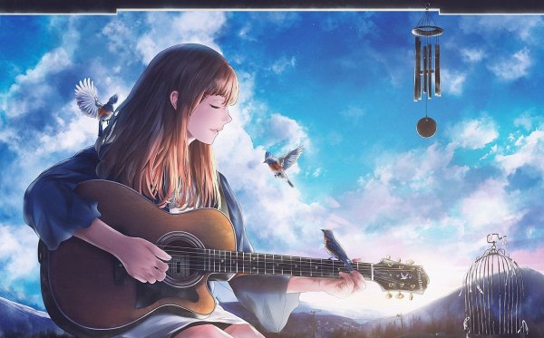 Парень с гитарой на природе