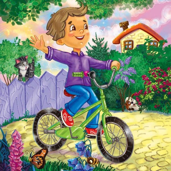 Мальчик катается на велосипеде