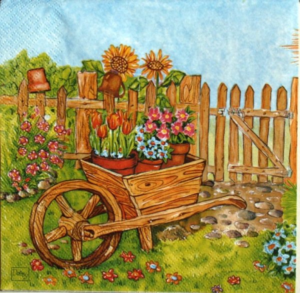 Тележка с цветами в саду