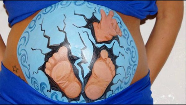 Рисунки на беременном животе