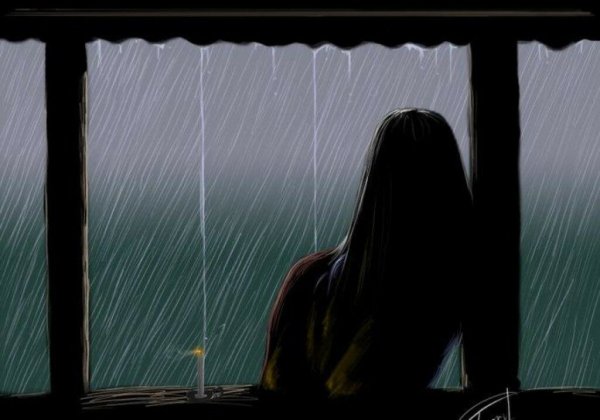 Девушка у дождливого окна