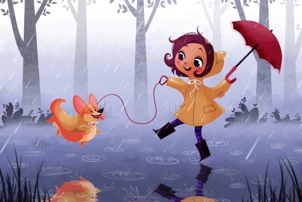 Веселая девочка под дождем