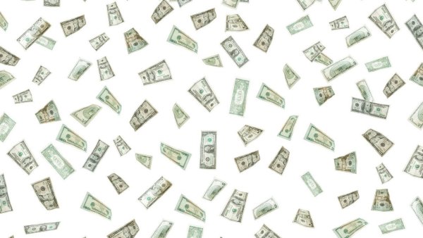 Падающие деньги на белом фоне