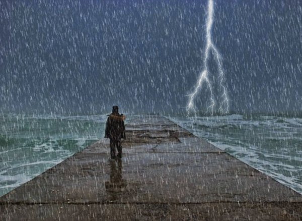 Одинокий человек под дождем