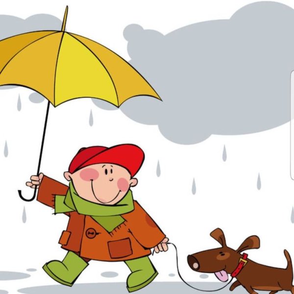 Мальчик гуляет с собакой под дождем