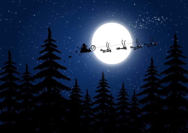 Санта на оленях в небе