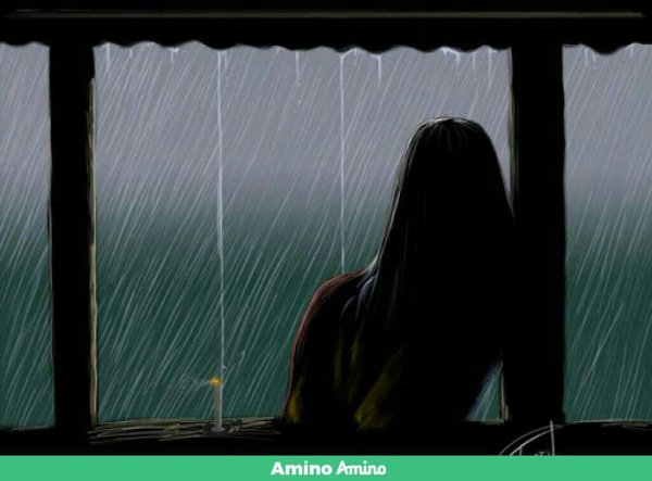 Девушка у дождливого окна
