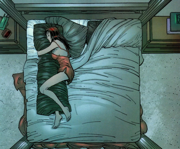 Девушка обнимает одеяло