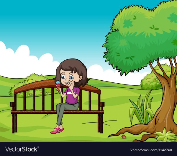 Девочка сидит на лавочке в парке для детей