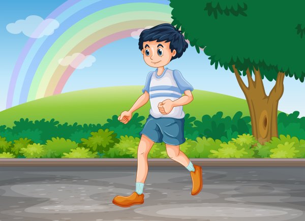 Мальчик бегает в парке